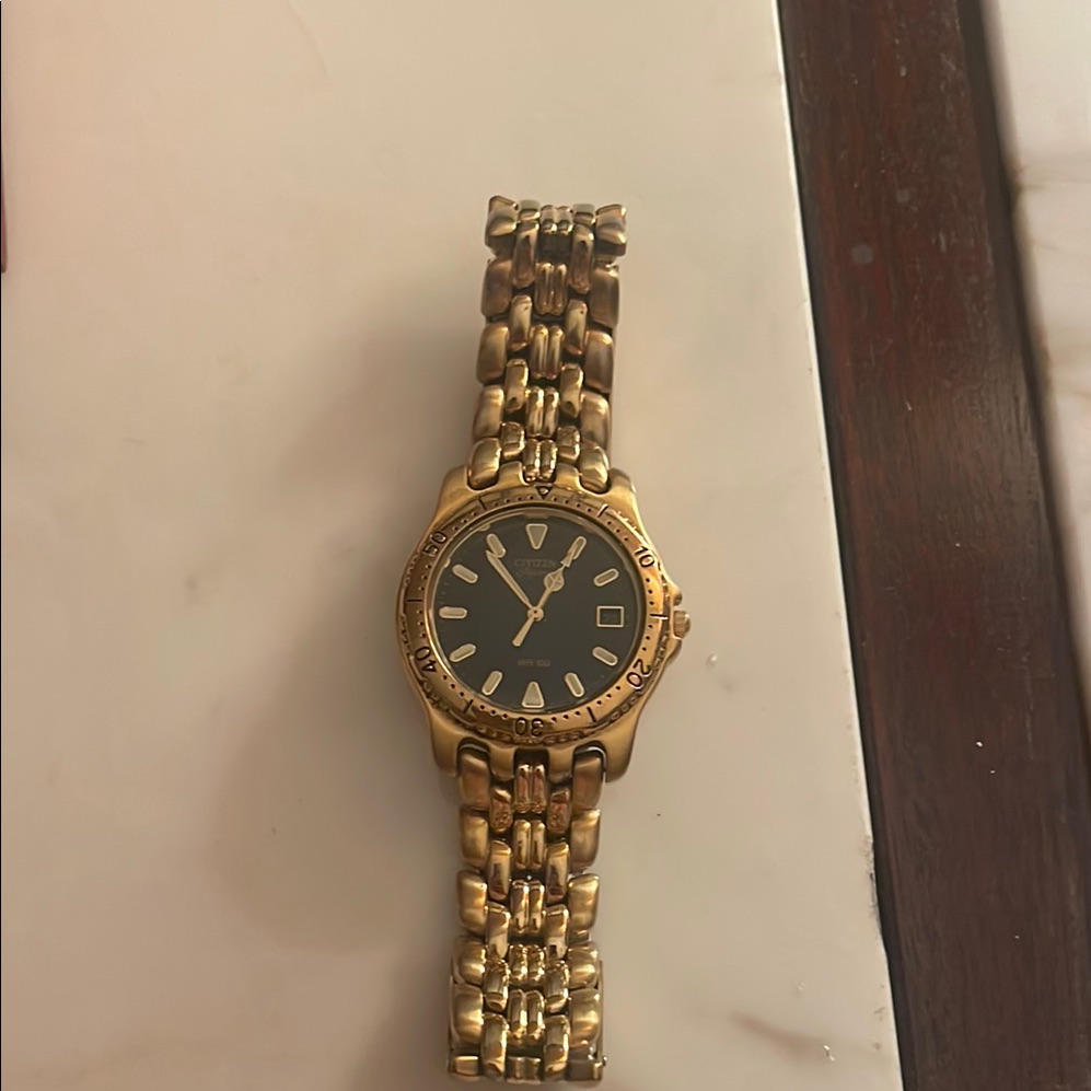 Gold Watch With Black Dial